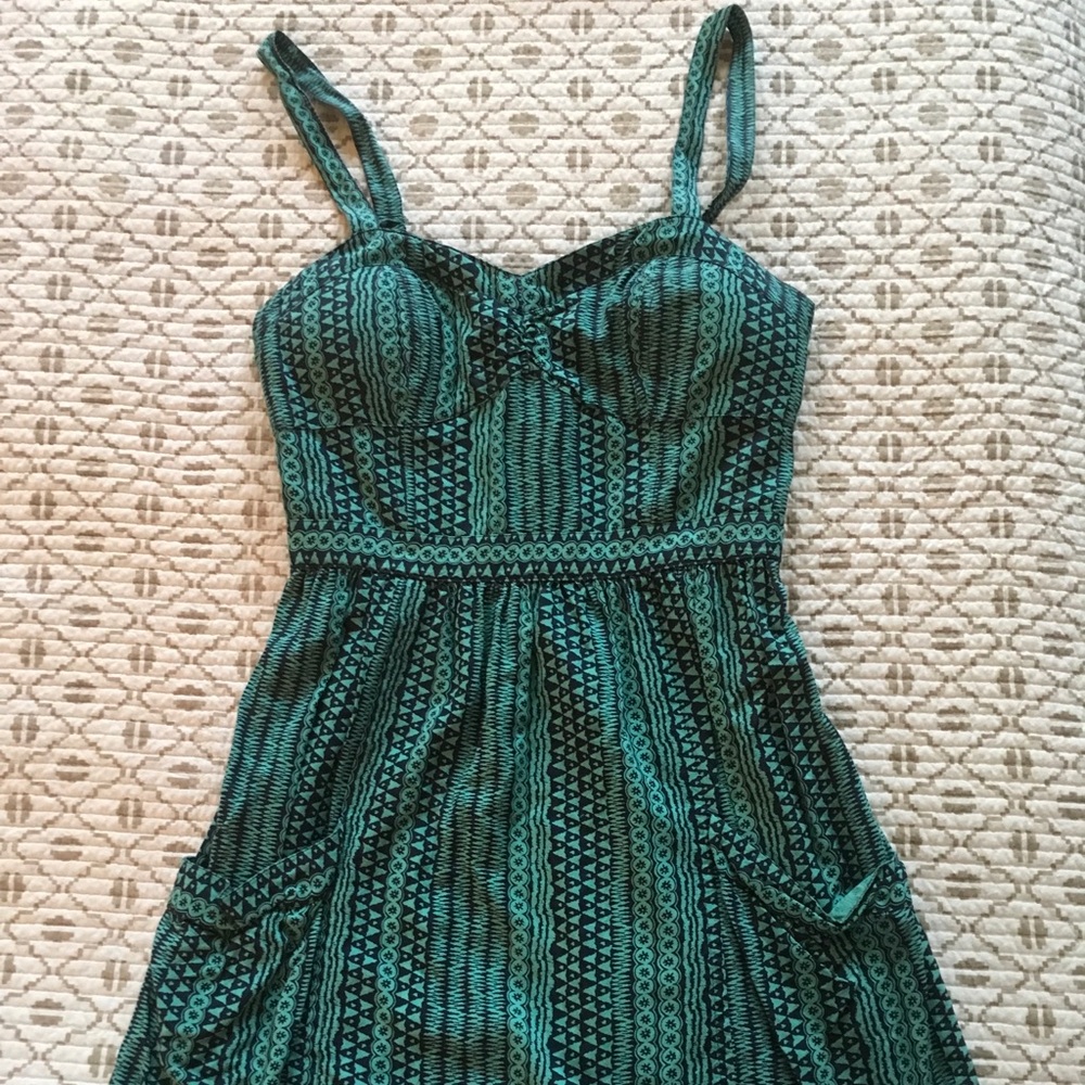 Cute mini dress with back detail and pockets!